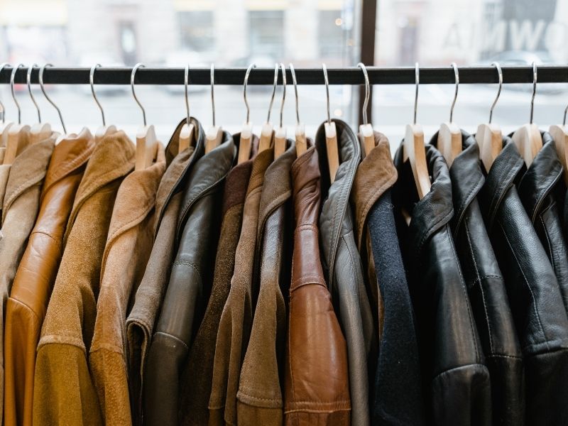 leather jackets hanging on coat rack