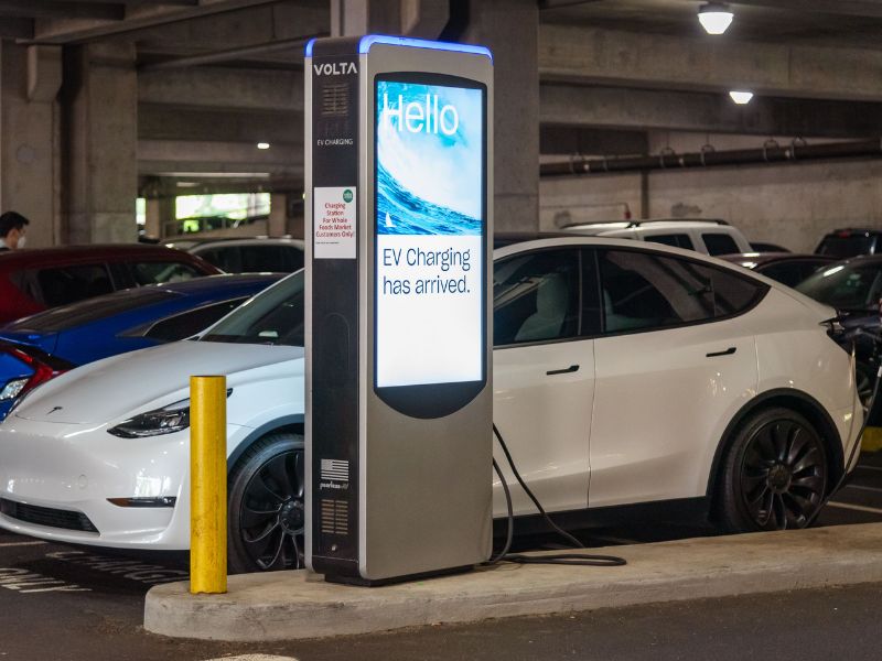 white Tesla charging with Volta station