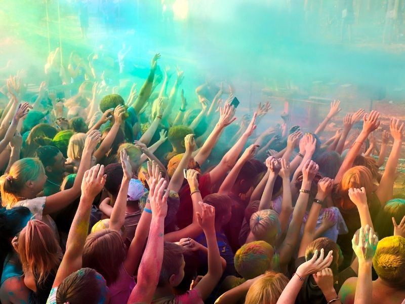 festival crowd with hands in the air