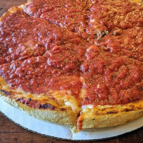 vegan pizza on cardboard